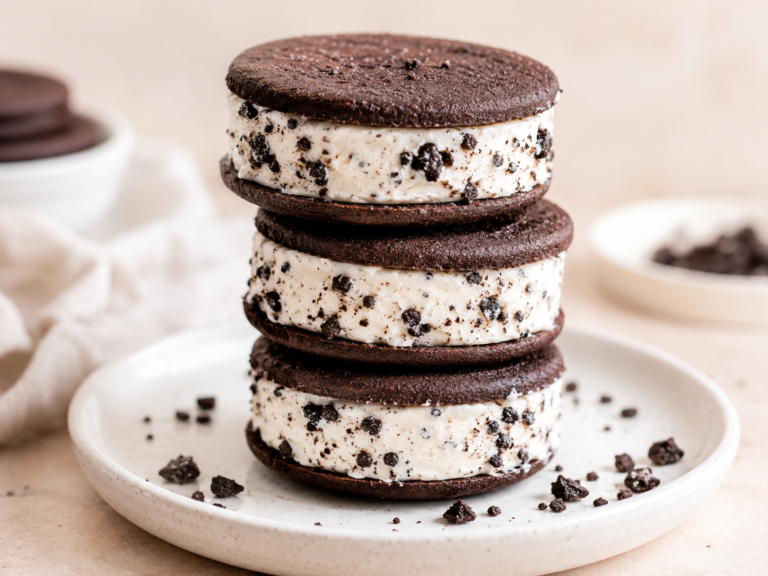 cookies and cream cheesecake sandwiches recipe — stack of three no-bake sandwiches