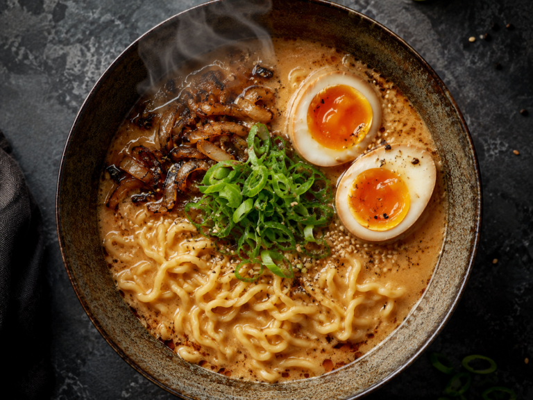 miso caramelized onion ramen recipe — bowl with soft-boiled egg and scallions